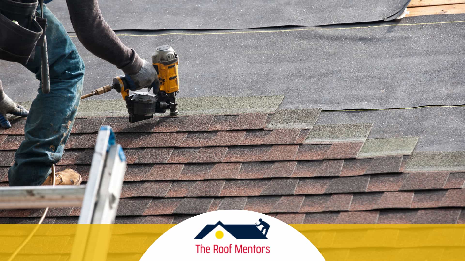 A roofing contractor is working on a shingled roof.